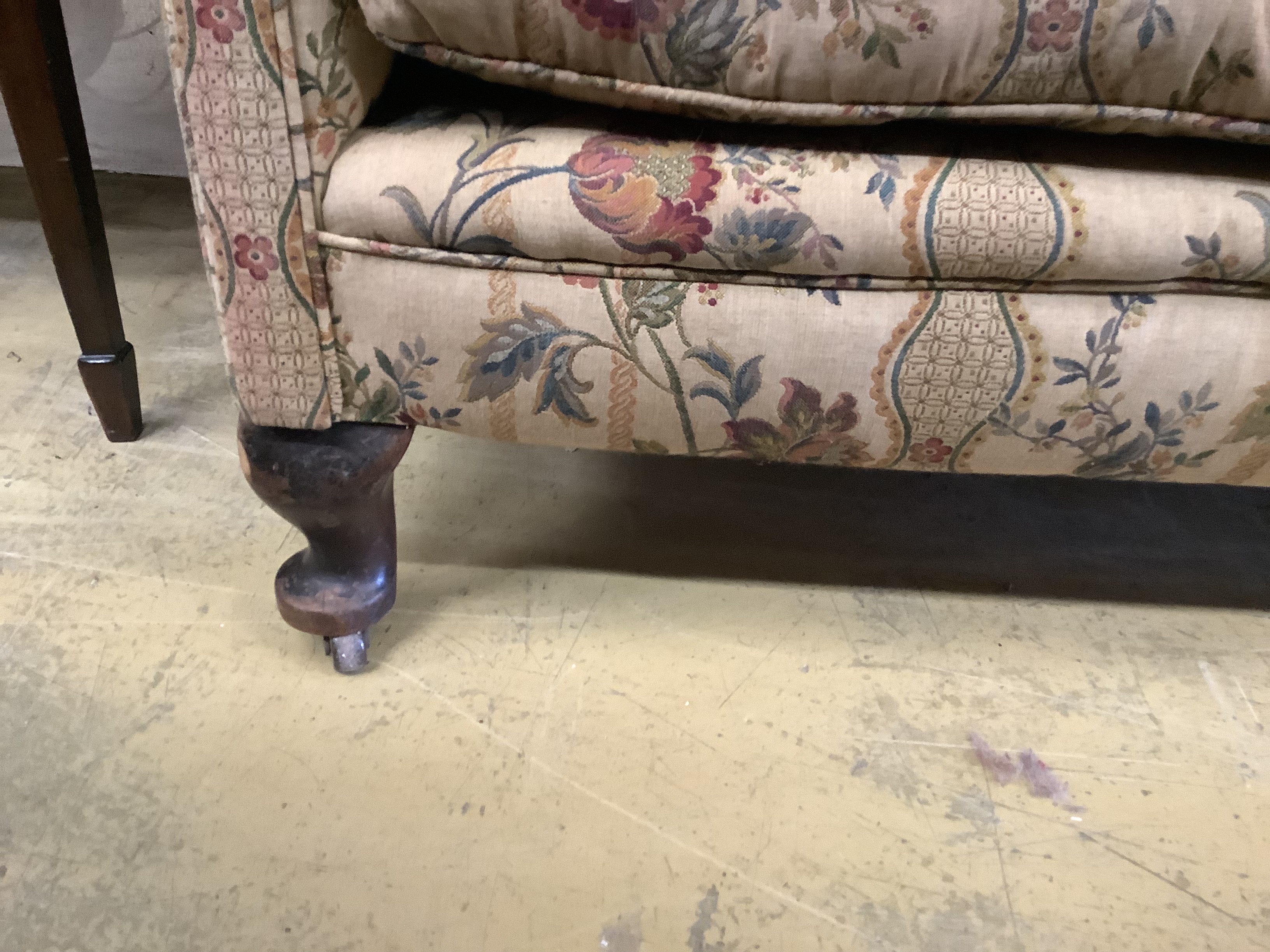 A barrel back upholstered 1920's two seat sofa, length 140cm, depth 70cm, height 110cm